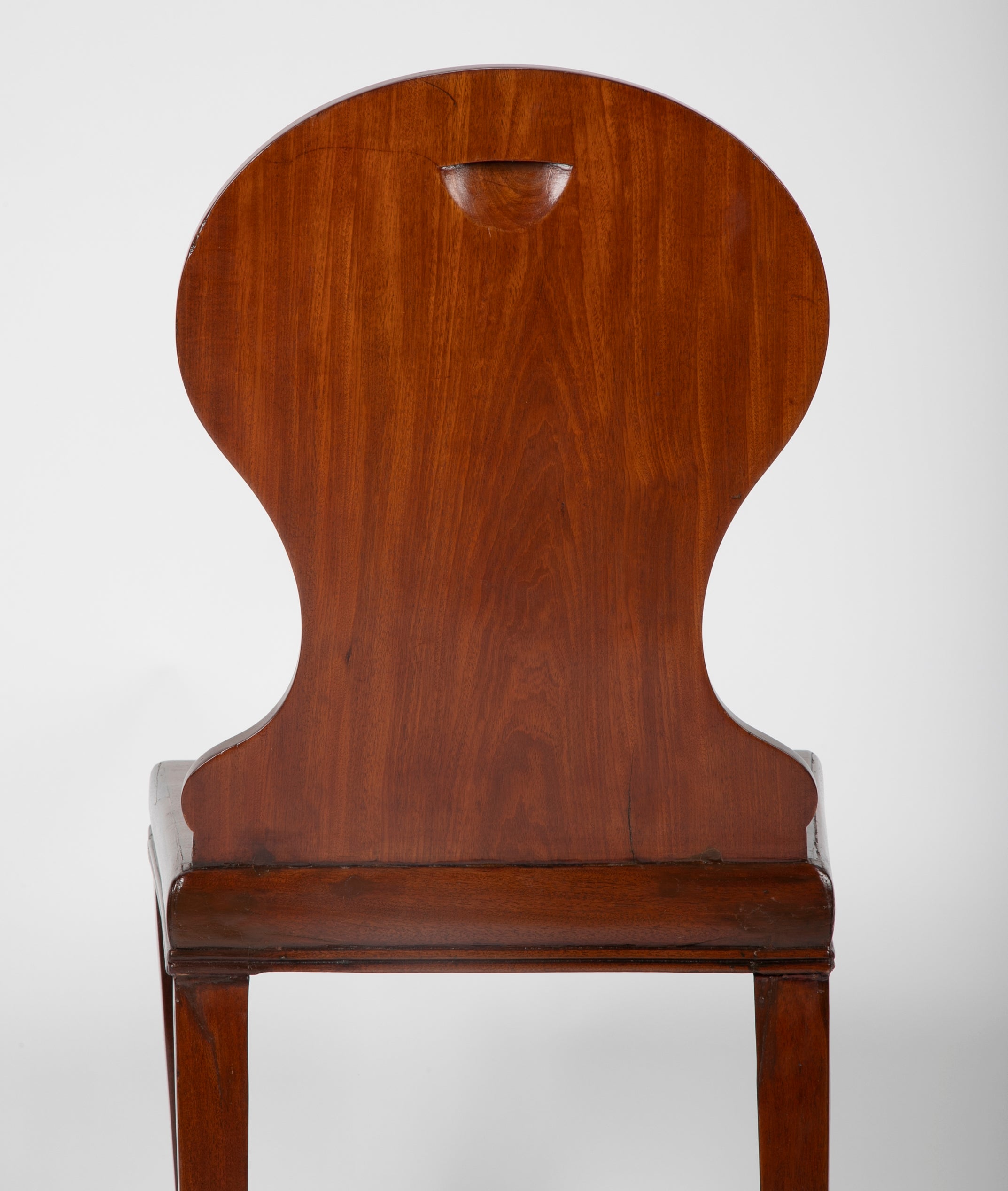 A Pair of Late Georgian Mahogany and Polychrome Hall Chairs