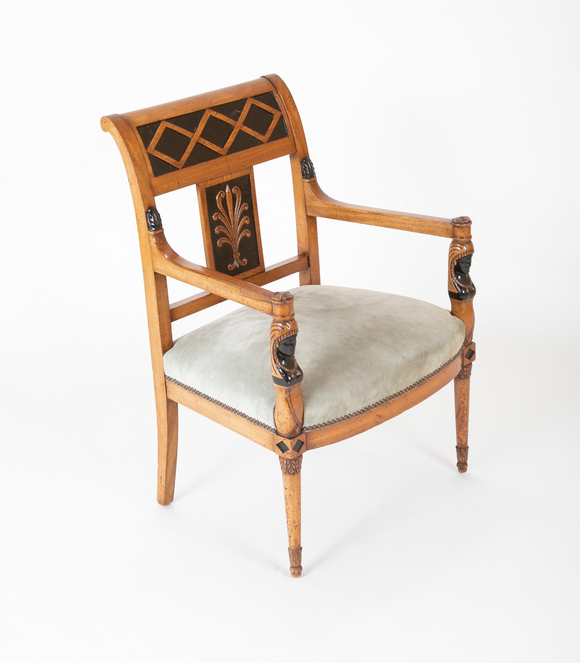 A Pair of Continental Neoclassical Chairs with Carved Egyptian Head on the Arm