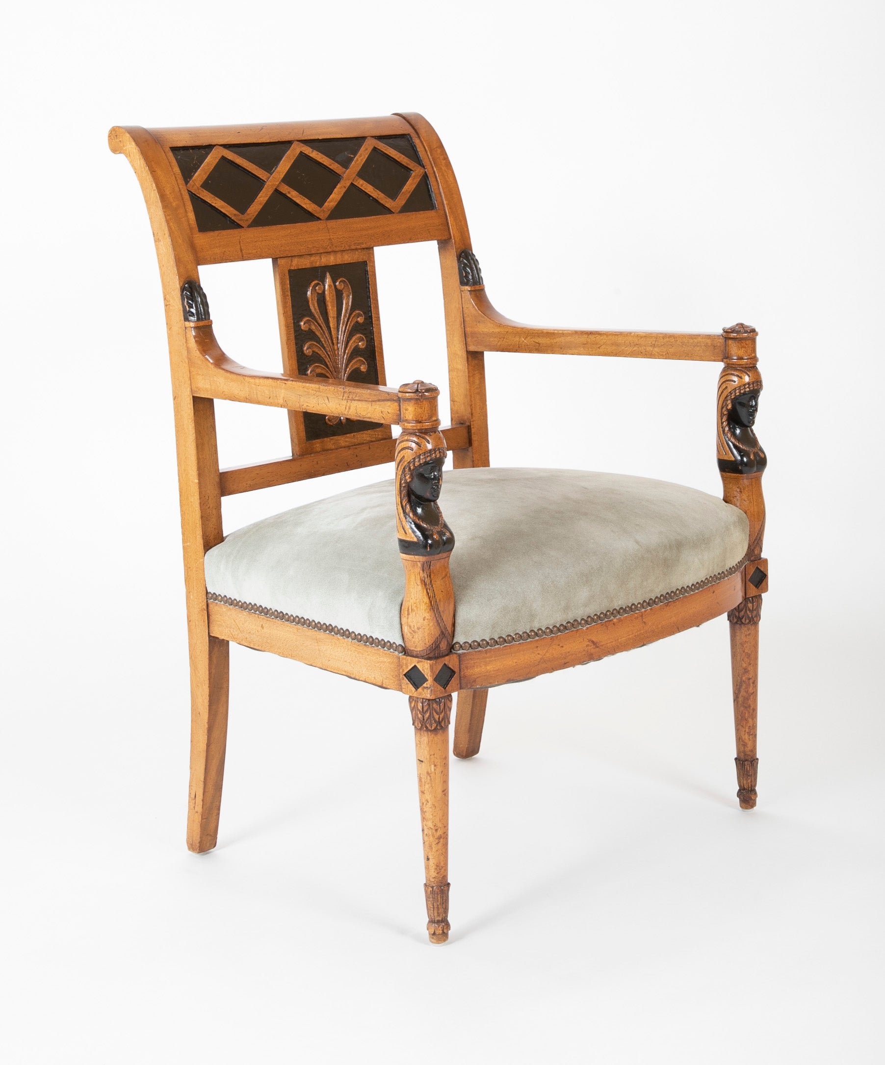 A Pair of Continental Neoclassical Chairs with Carved Egyptian Head on the Arm