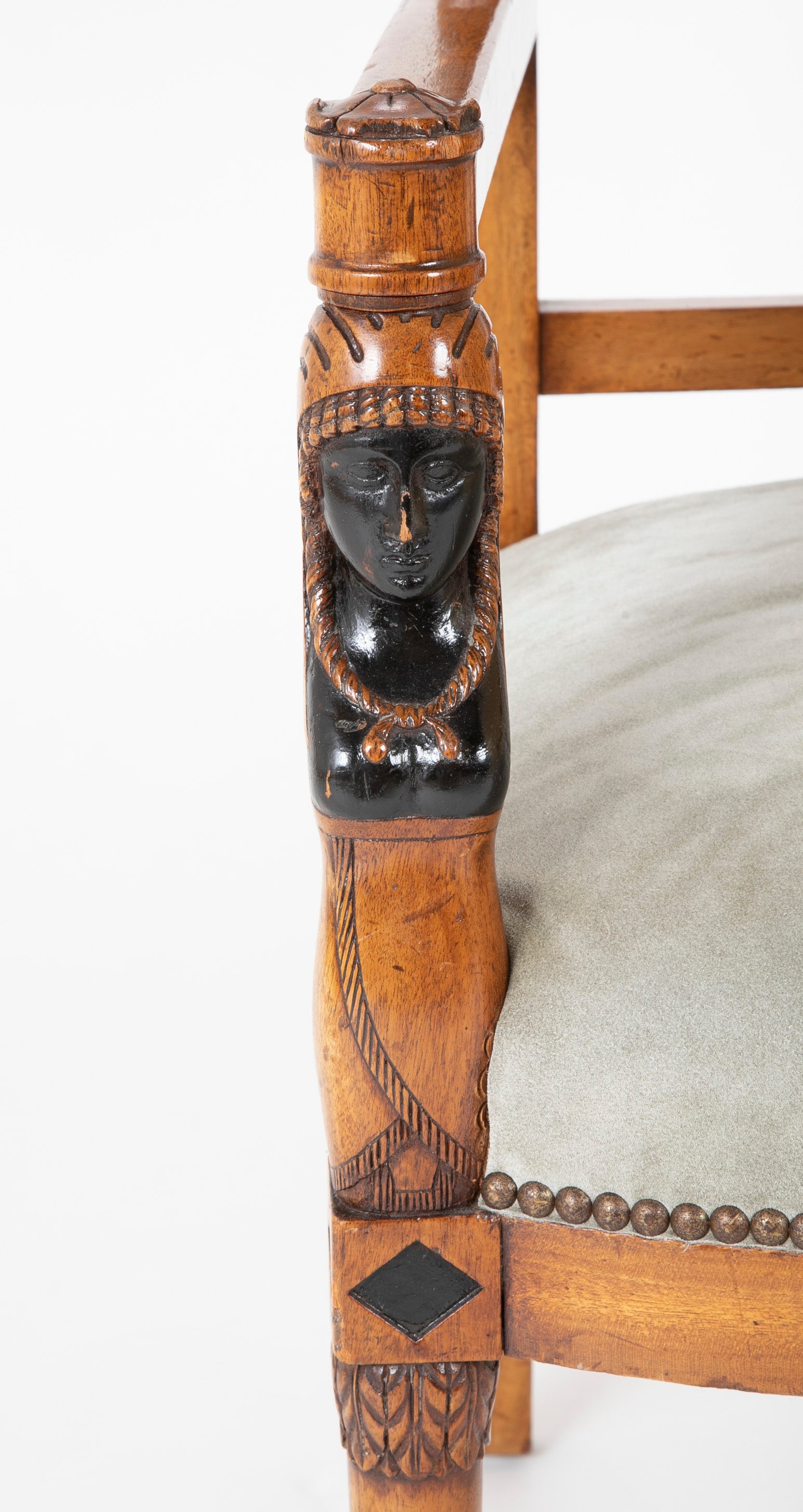 A Pair of Continental Neoclassical Chairs with Carved Egyptian Head on the Arm