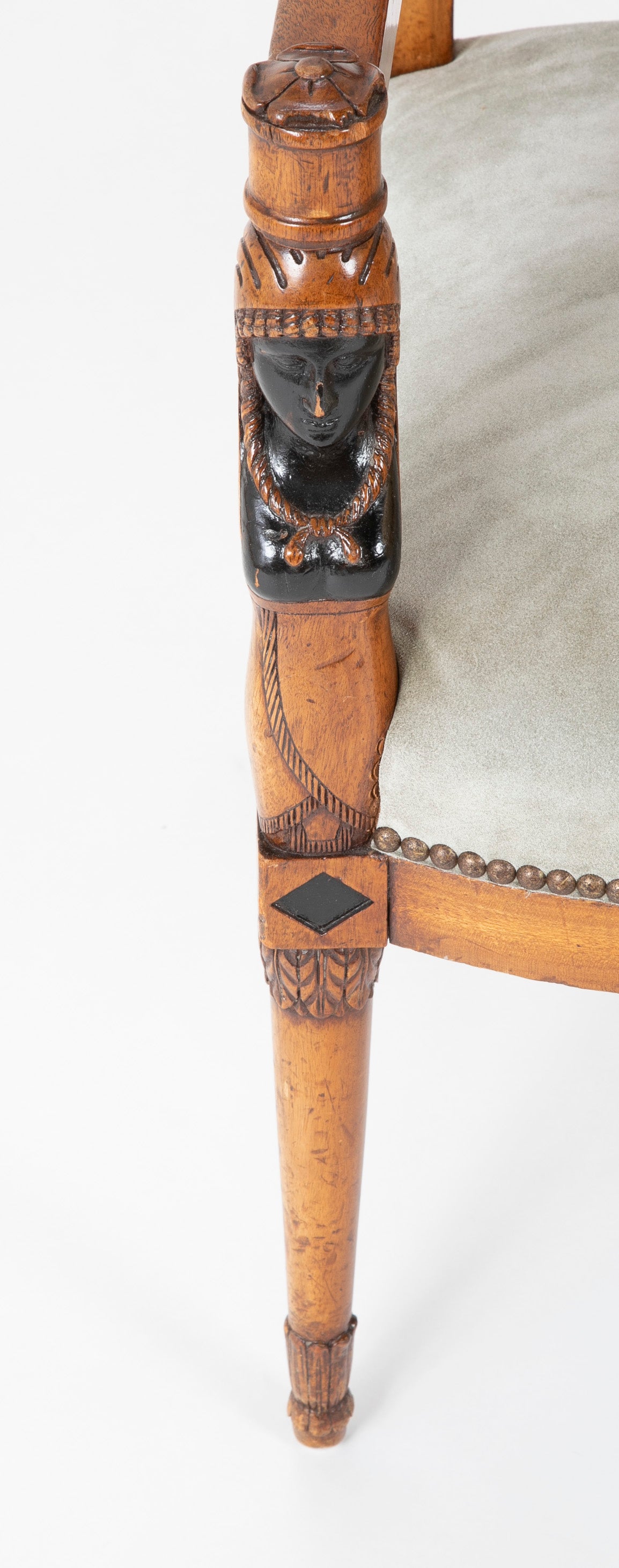 A Pair of Continental Neoclassical Chairs with Carved Egyptian Head on the Arm