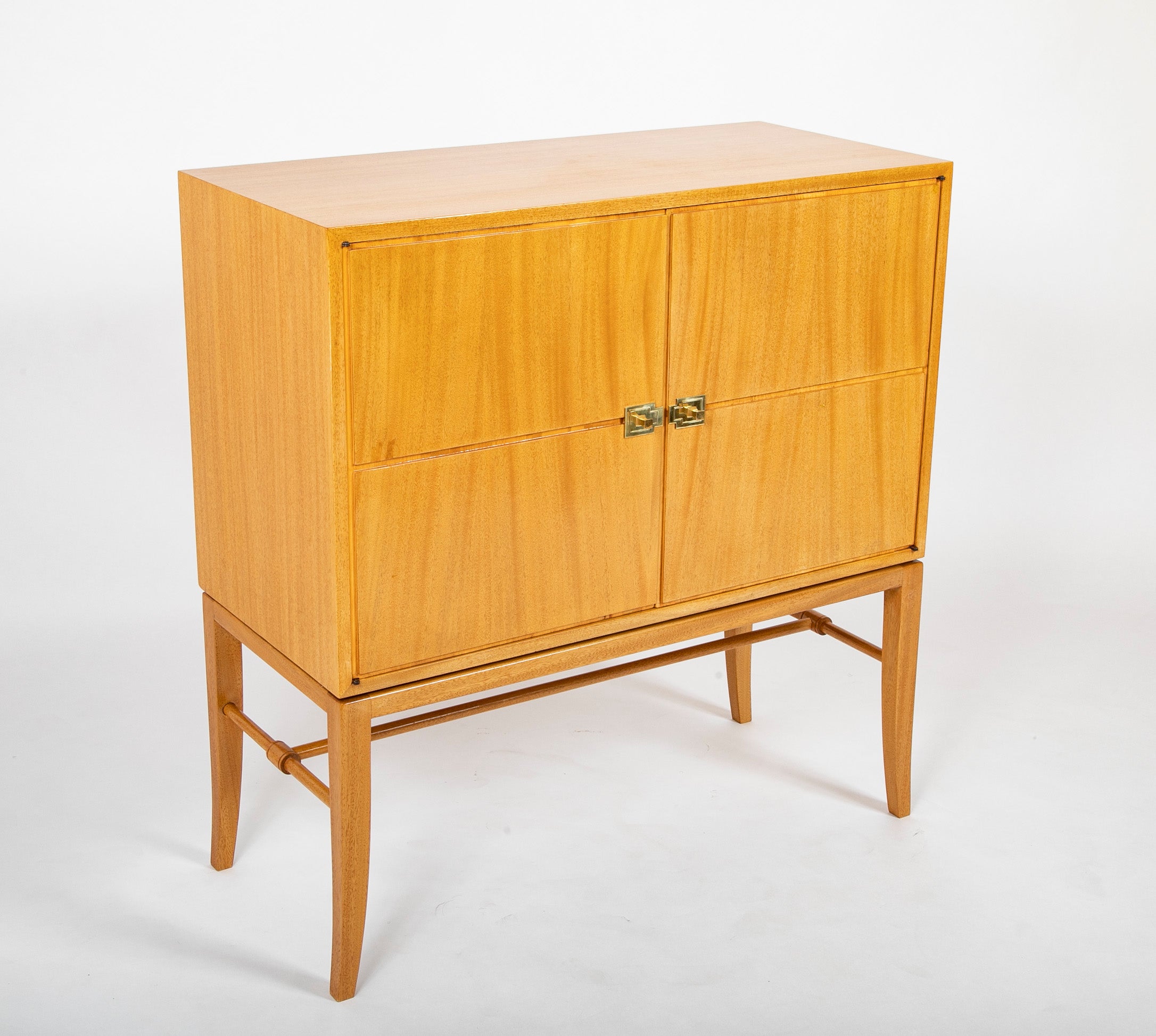 A Tommi Parzinger cabinet with 3 interior drawers