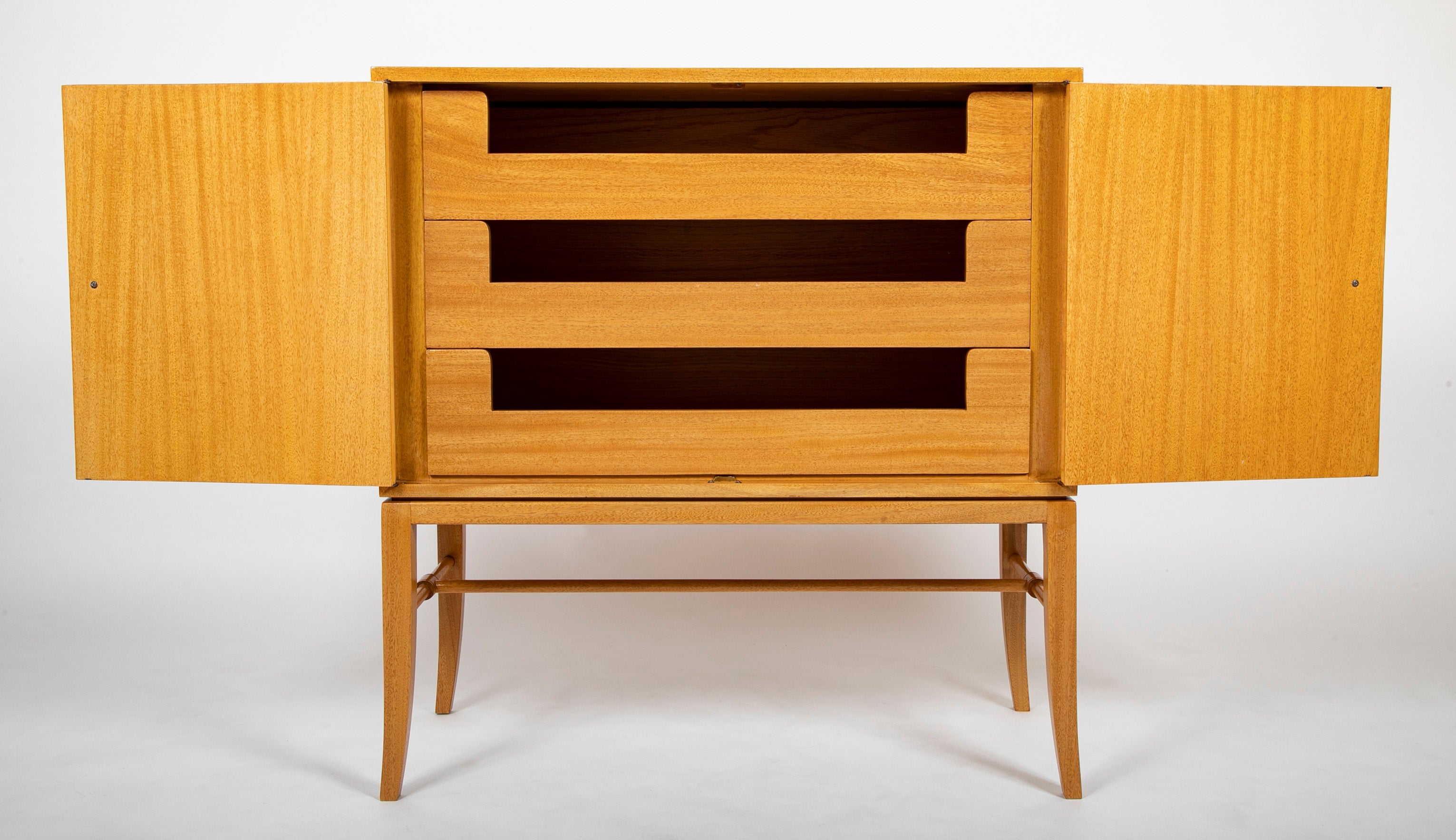A Tommi Parzinger cabinet with 3 interior drawers