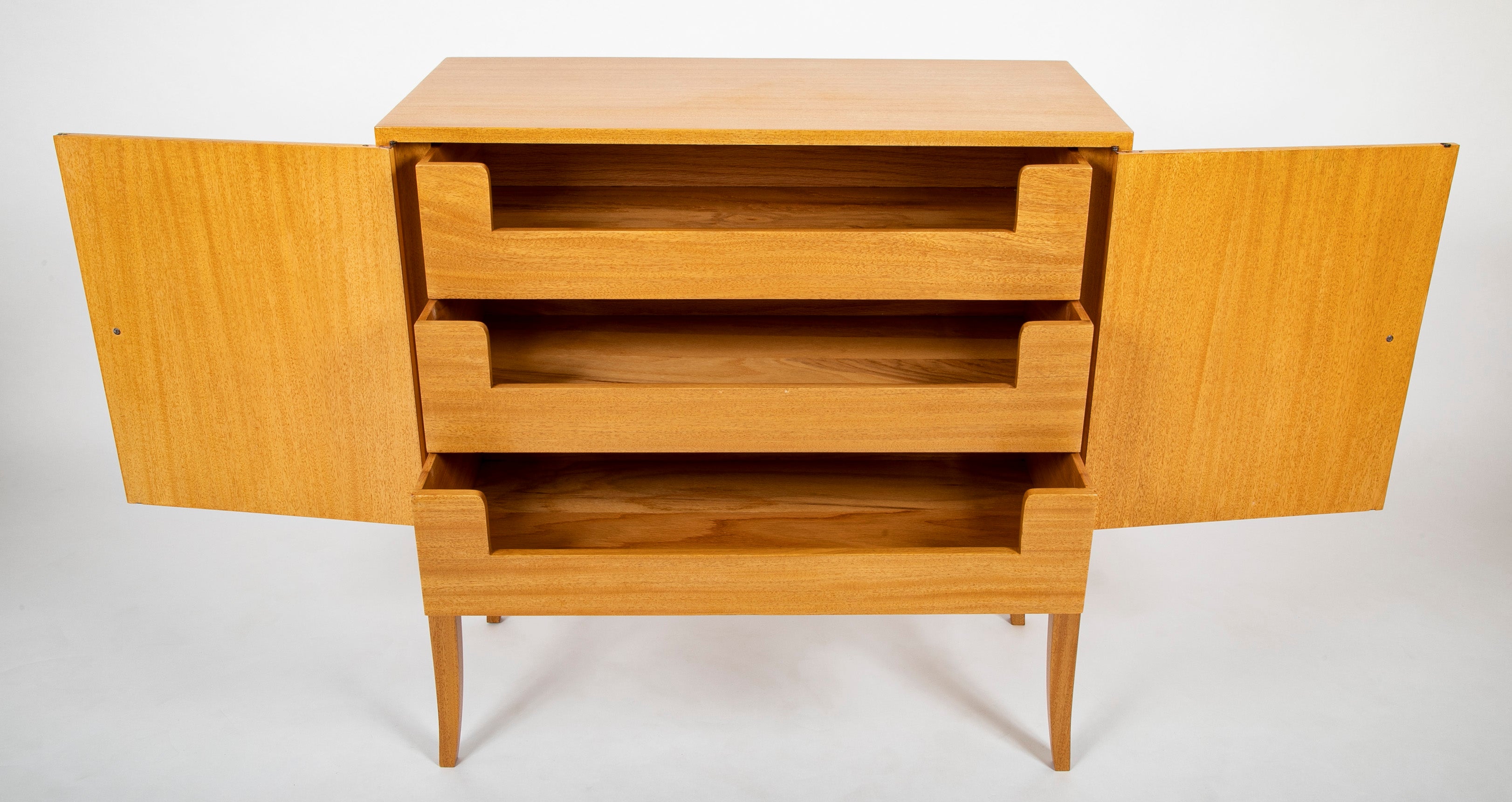 A Tommi Parzinger cabinet with 3 interior drawers