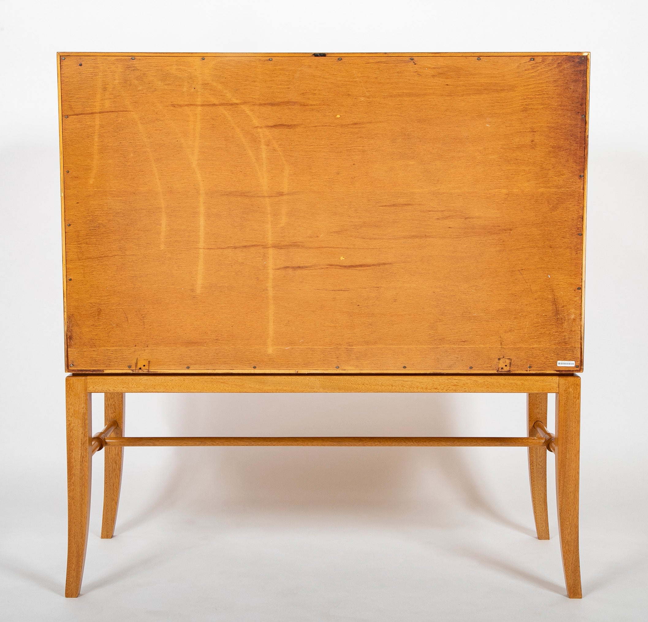 A Tommi Parzinger cabinet with 3 interior drawers