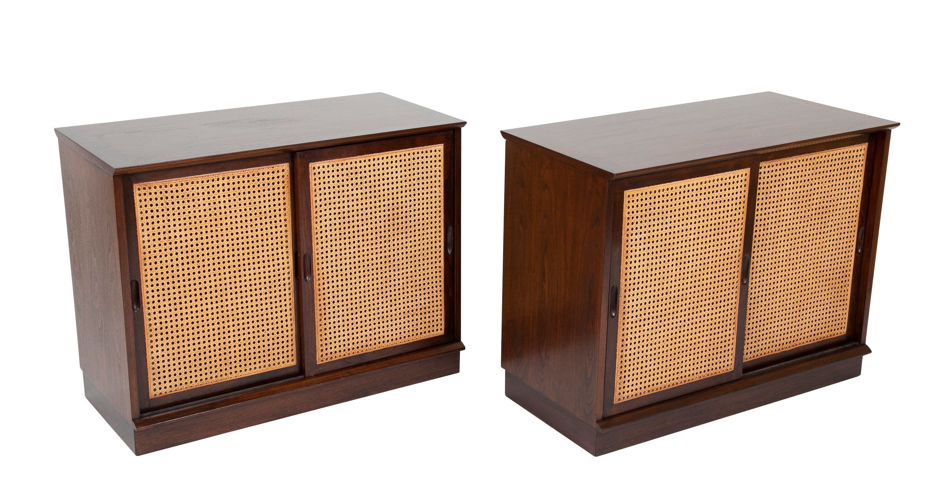 A Pair of Walnut Cabinets with Cane Fronted Sliding Doors