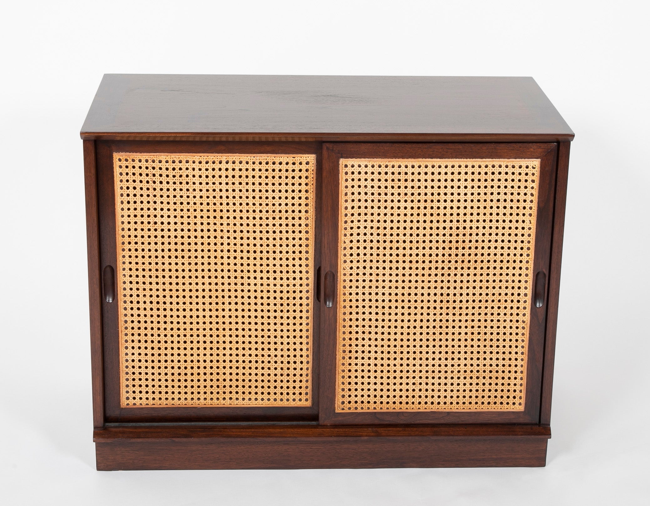 A Pair of Walnut Cabinets with Cane Fronted Sliding Doors