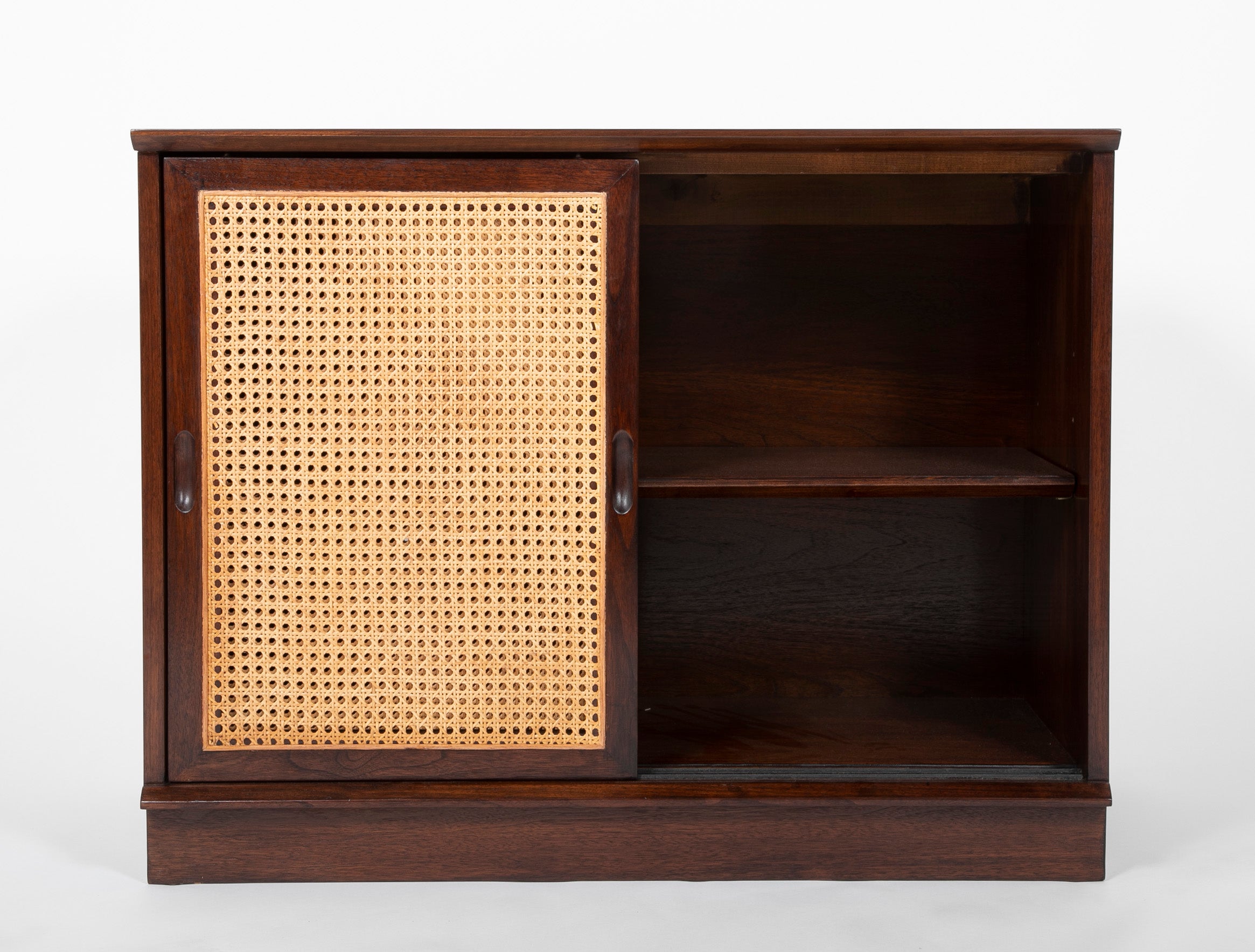 A Pair of Walnut Cabinets with Cane Fronted Sliding Doors