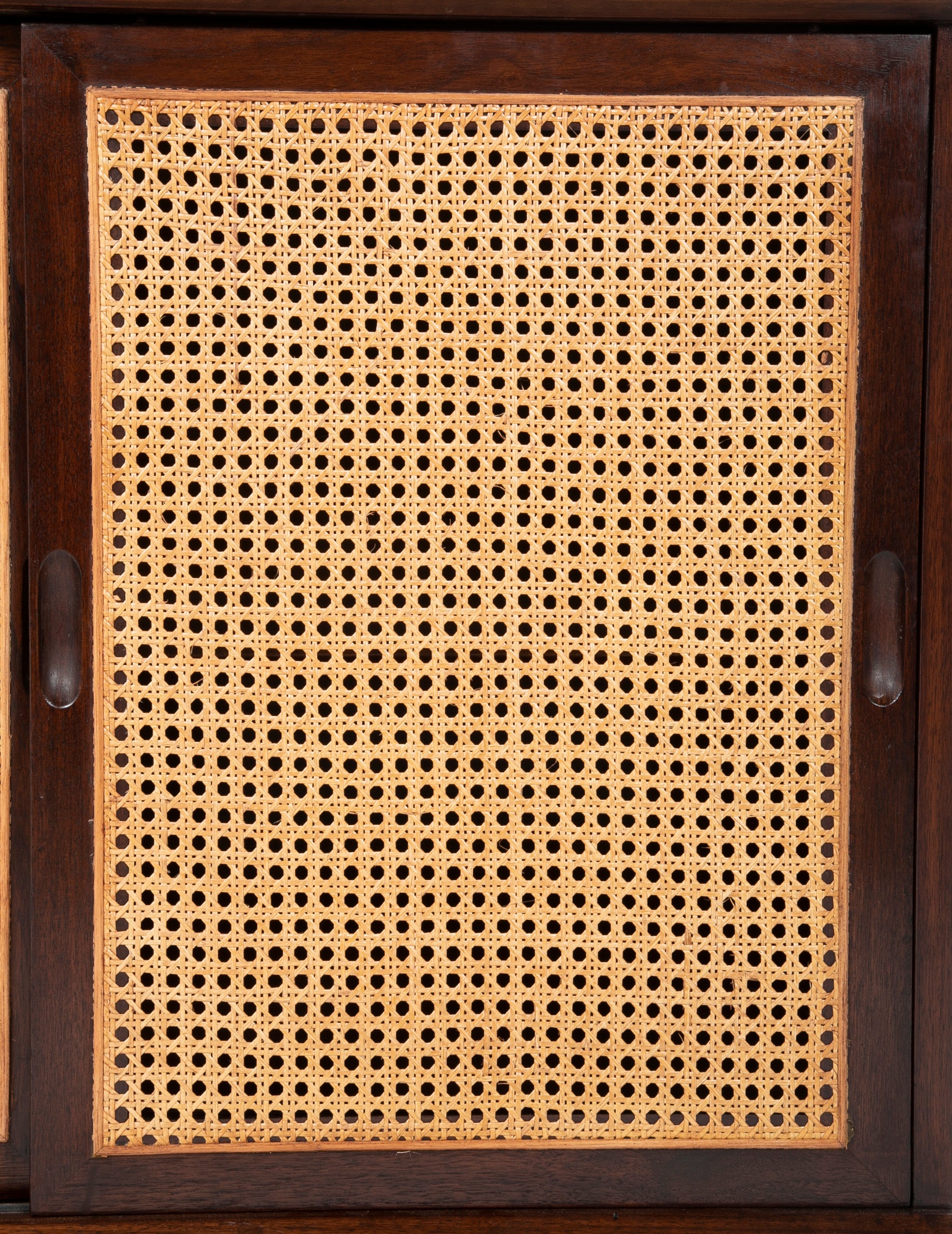 A Pair of Walnut Cabinets with Cane Fronted Sliding Doors