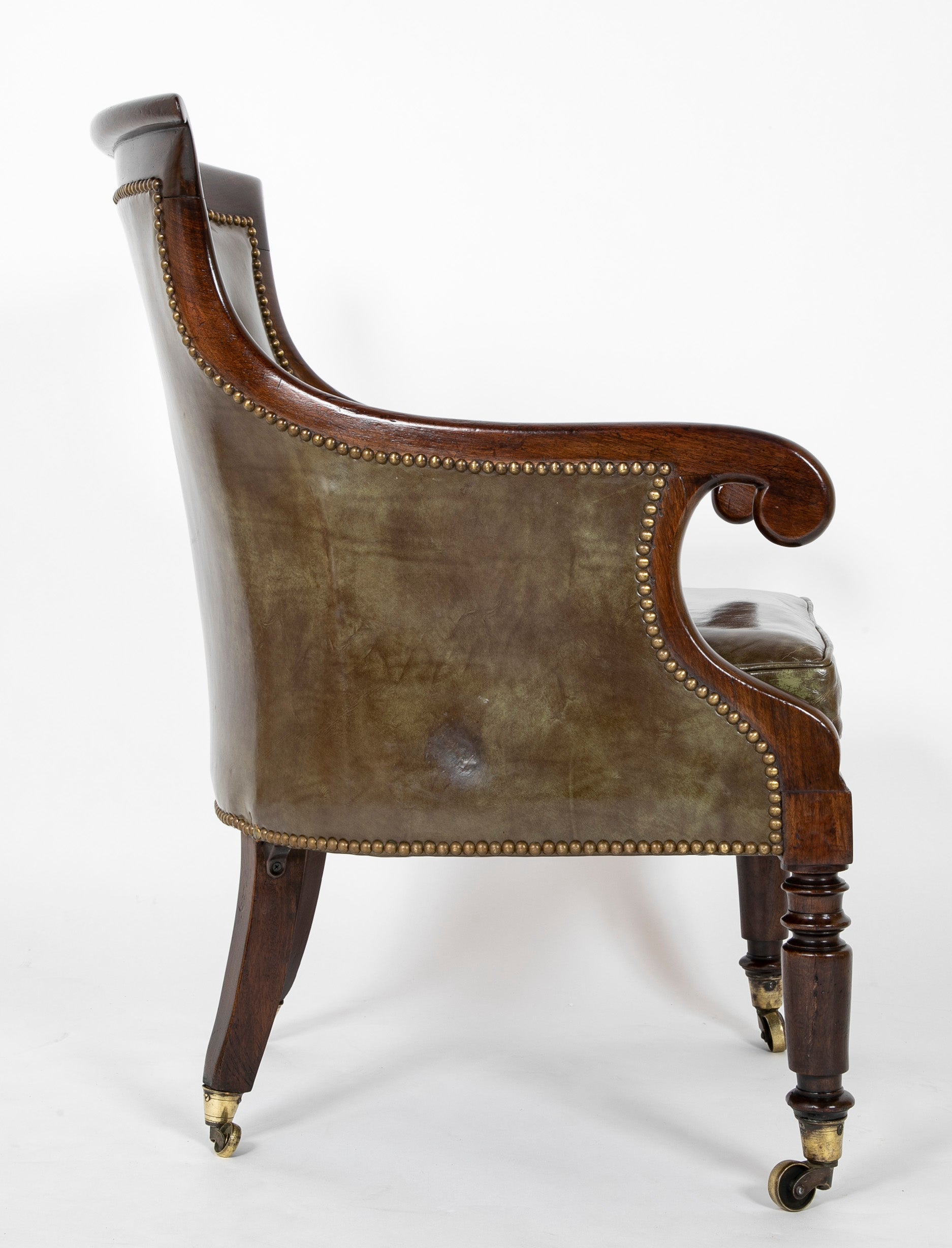 A Mahogany Library Chair with Curled & Carved Crest Upholstered in Leather