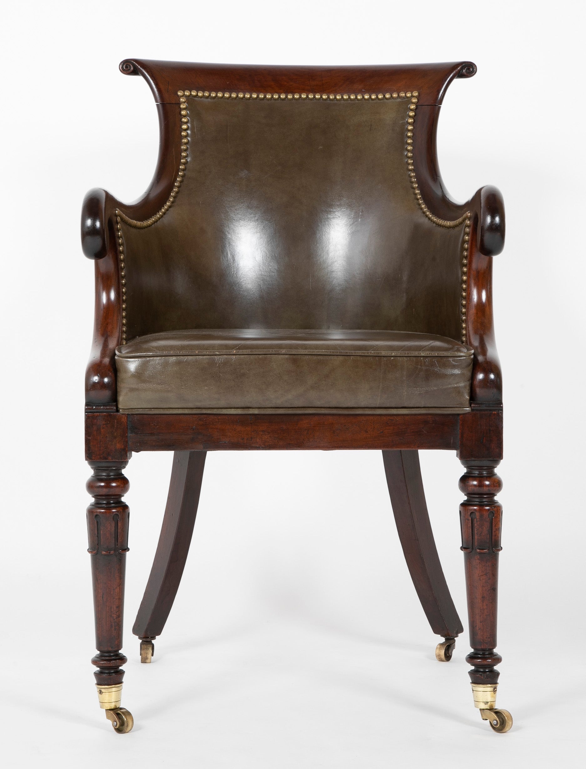 A Mahogany Library Chair with Curled & Carved Crest Upholstered in Leather