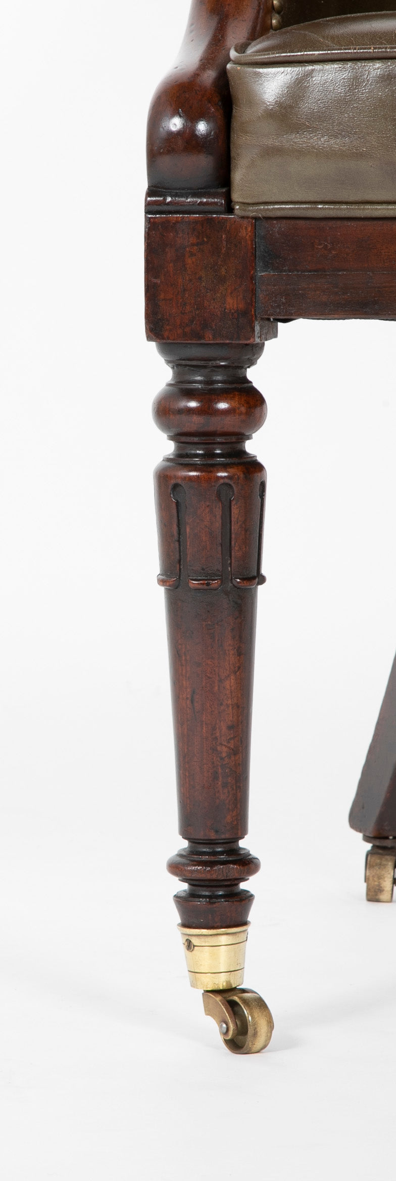 A Mahogany Library Chair with Curled & Carved Crest Upholstered in Leather