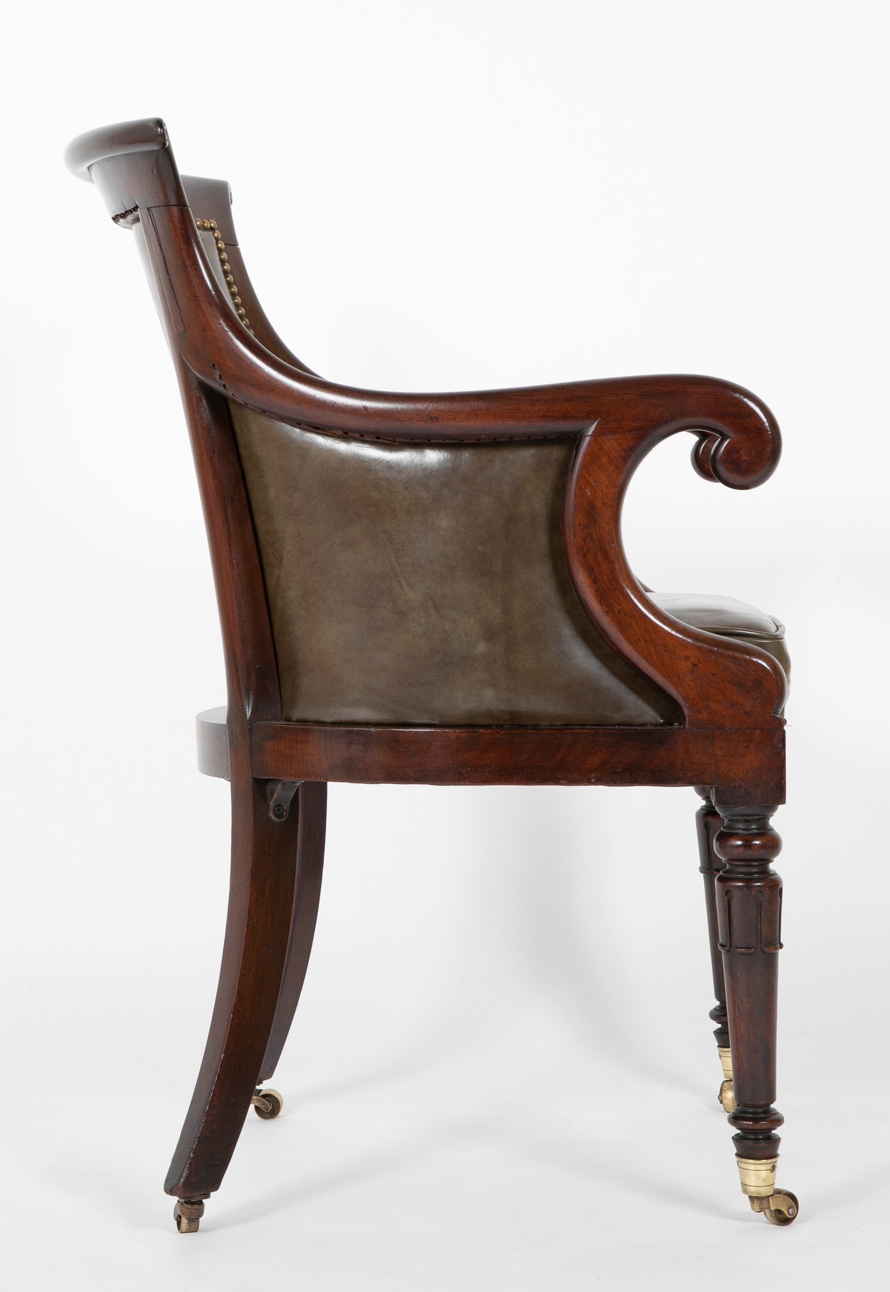 A Mahogany Library Chair with Curled & Carved Crest Upholstered in Leather