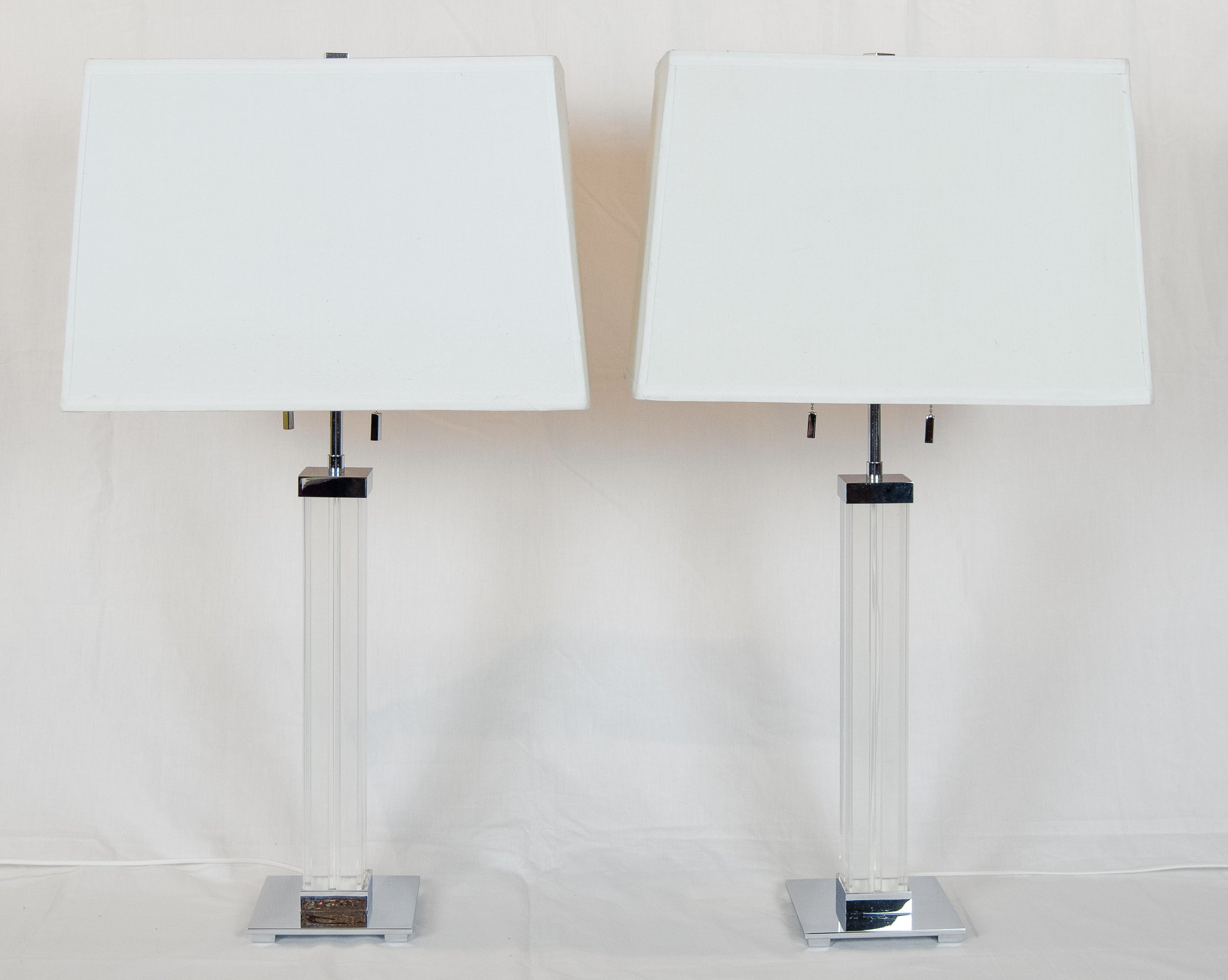 A Pair of Karl Springer Lucite and Chrome Table Lamps