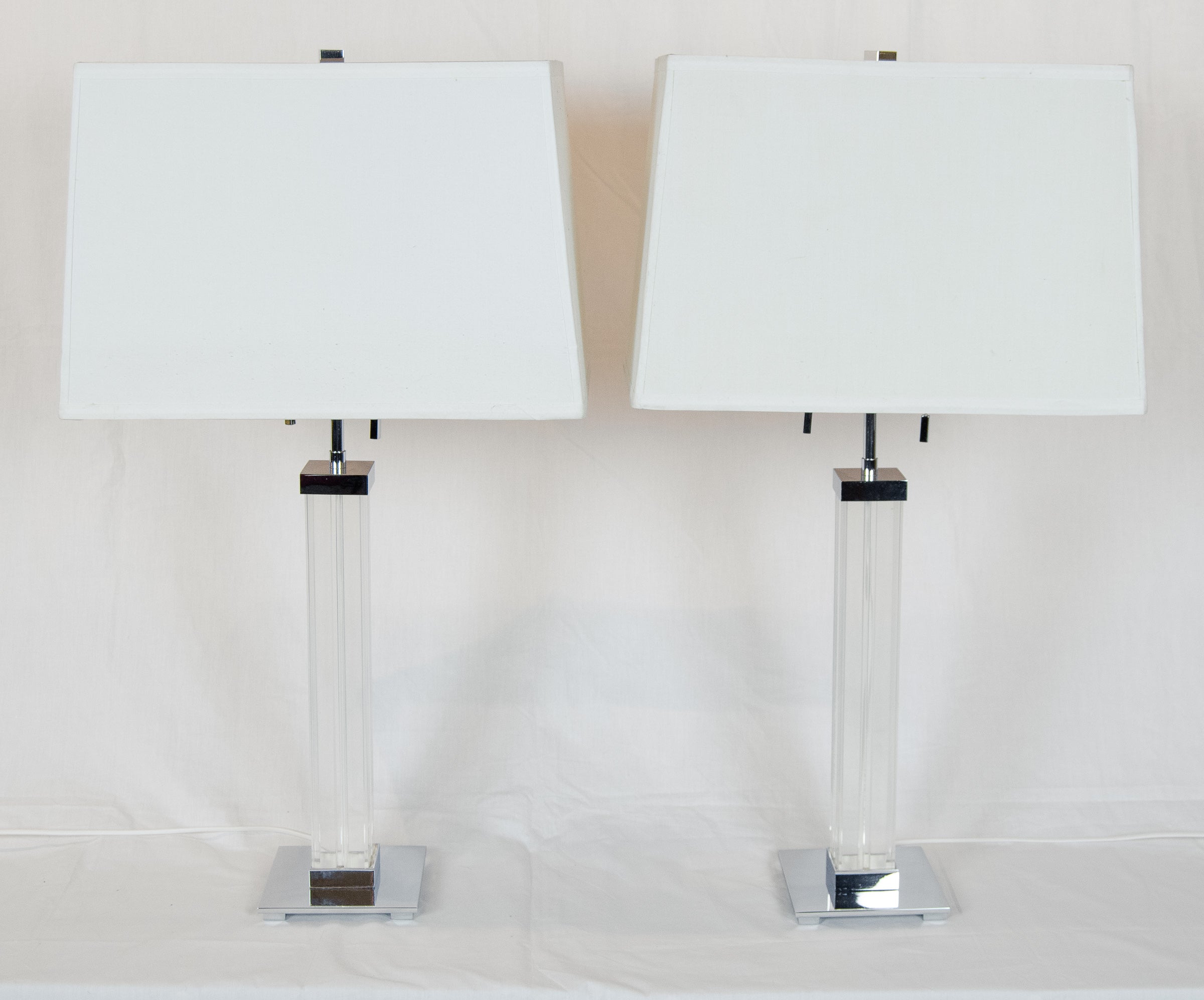 A Pair of Karl Springer Lucite and Chrome Table Lamps