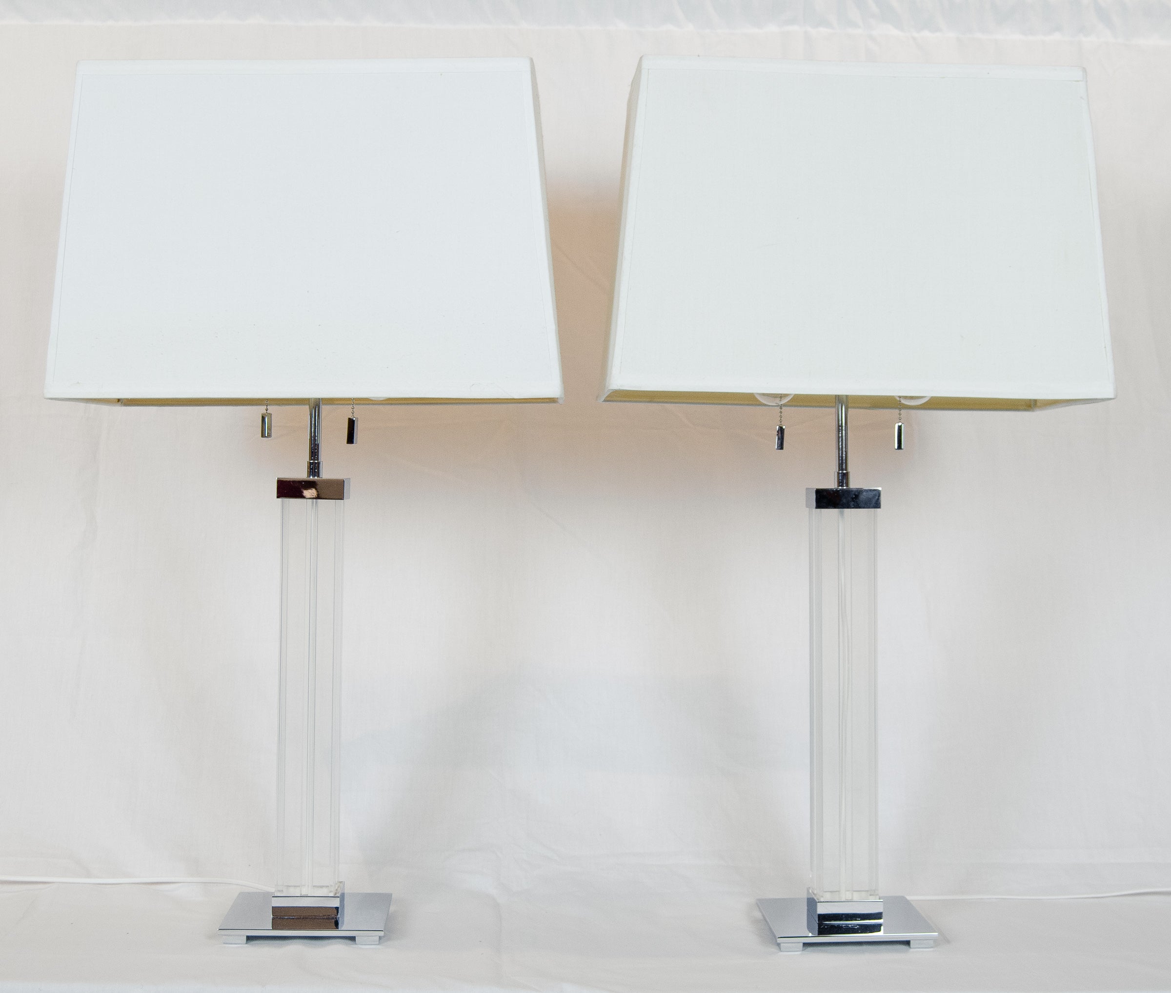 A Pair of Karl Springer Lucite and Chrome Table Lamps
