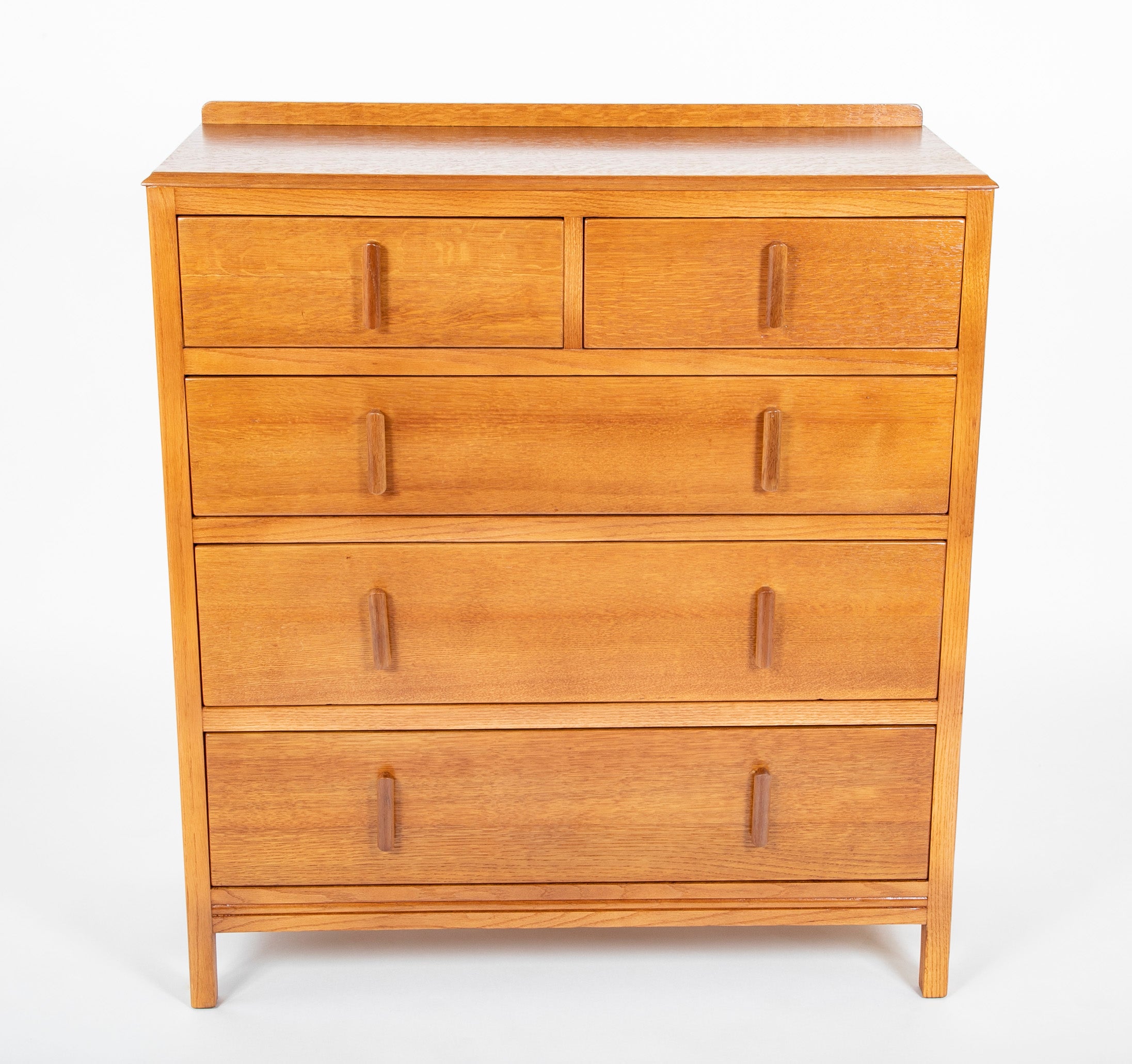 Pair of English Cotswold School Limed Oak Five Drawer Chests