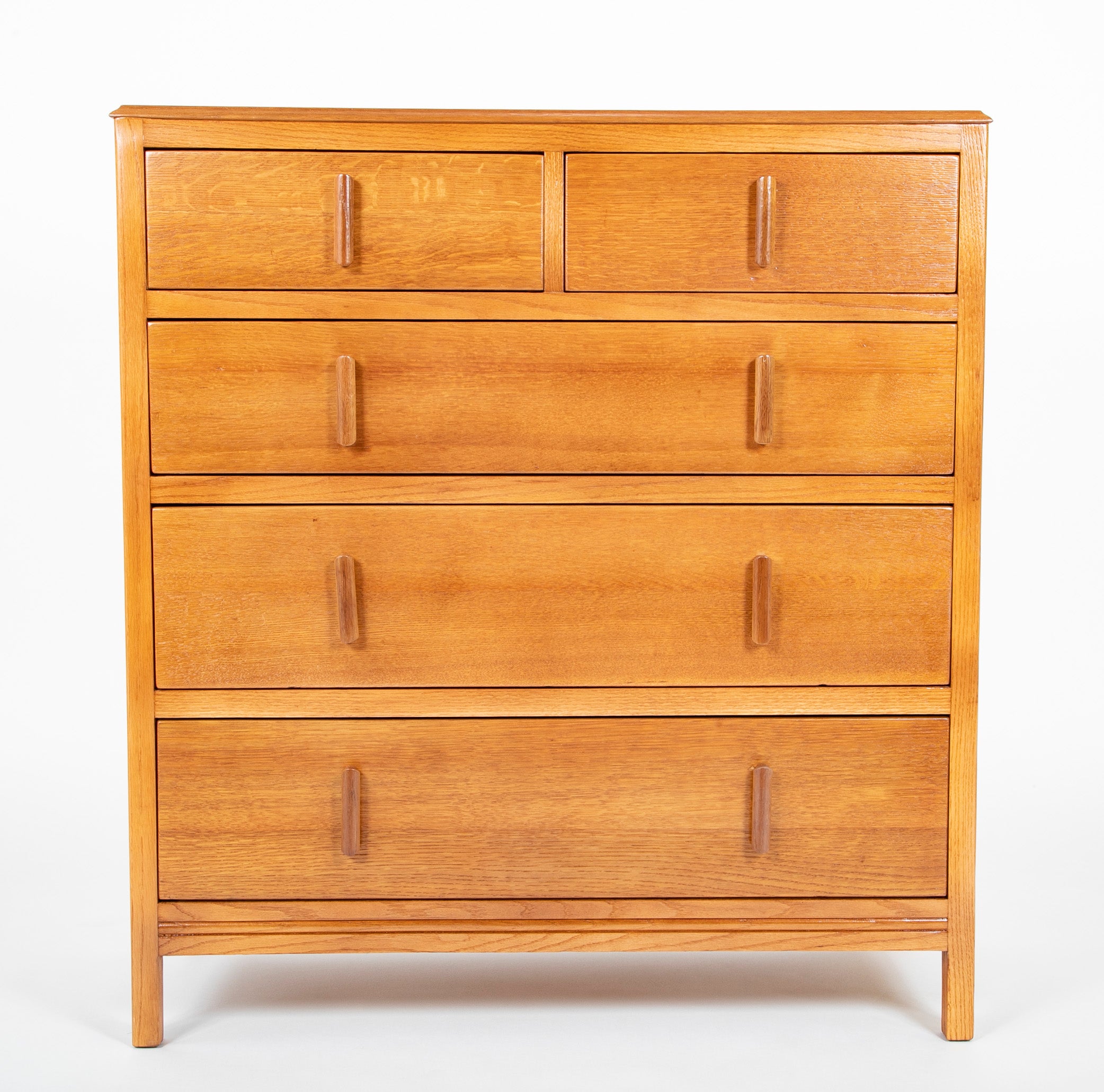 Pair of English Cotswold School Limed Oak Five Drawer Chests