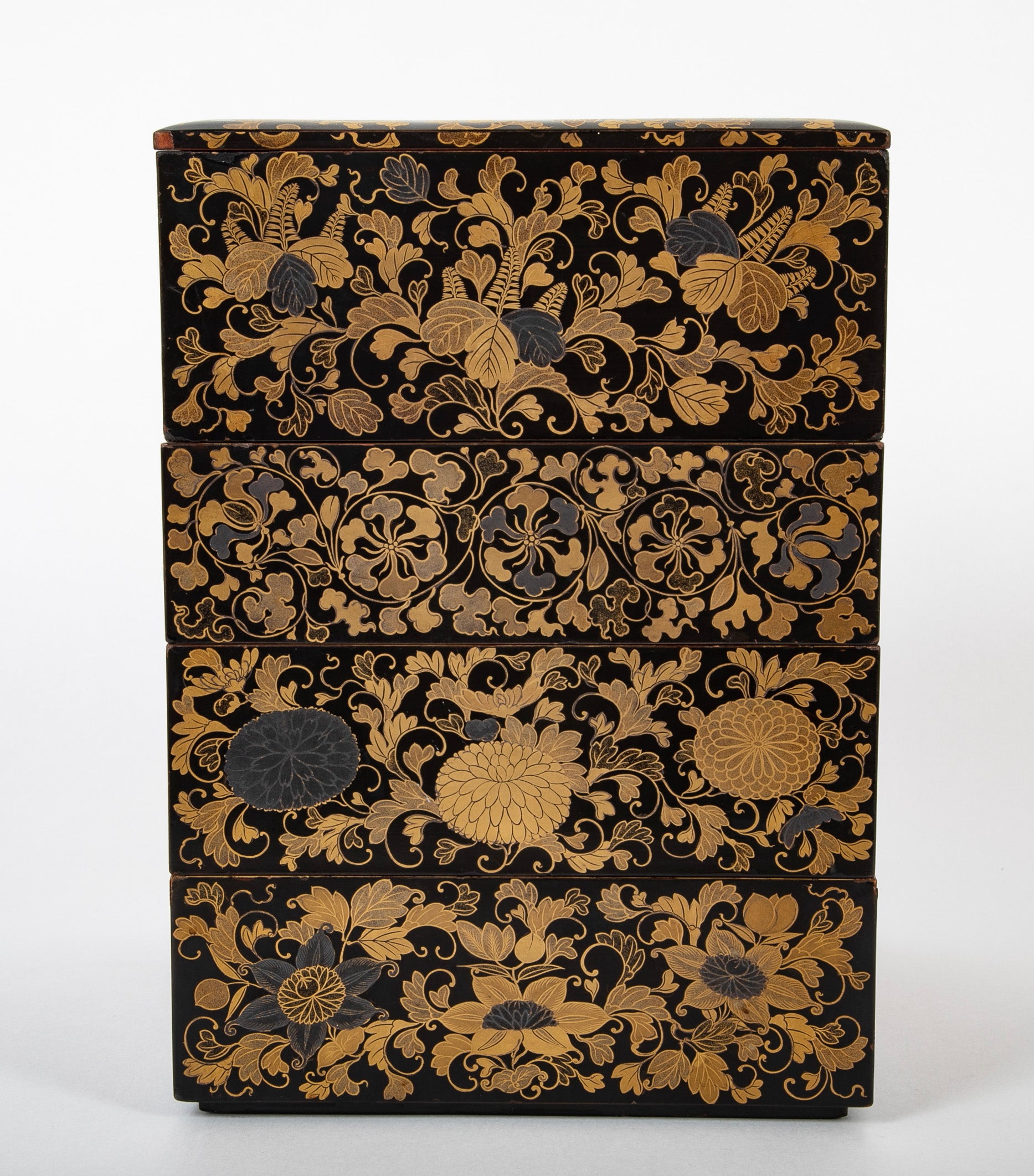 A Japanese Black Lacquer 4 Tier Bento Box with Gilt Floral Designs