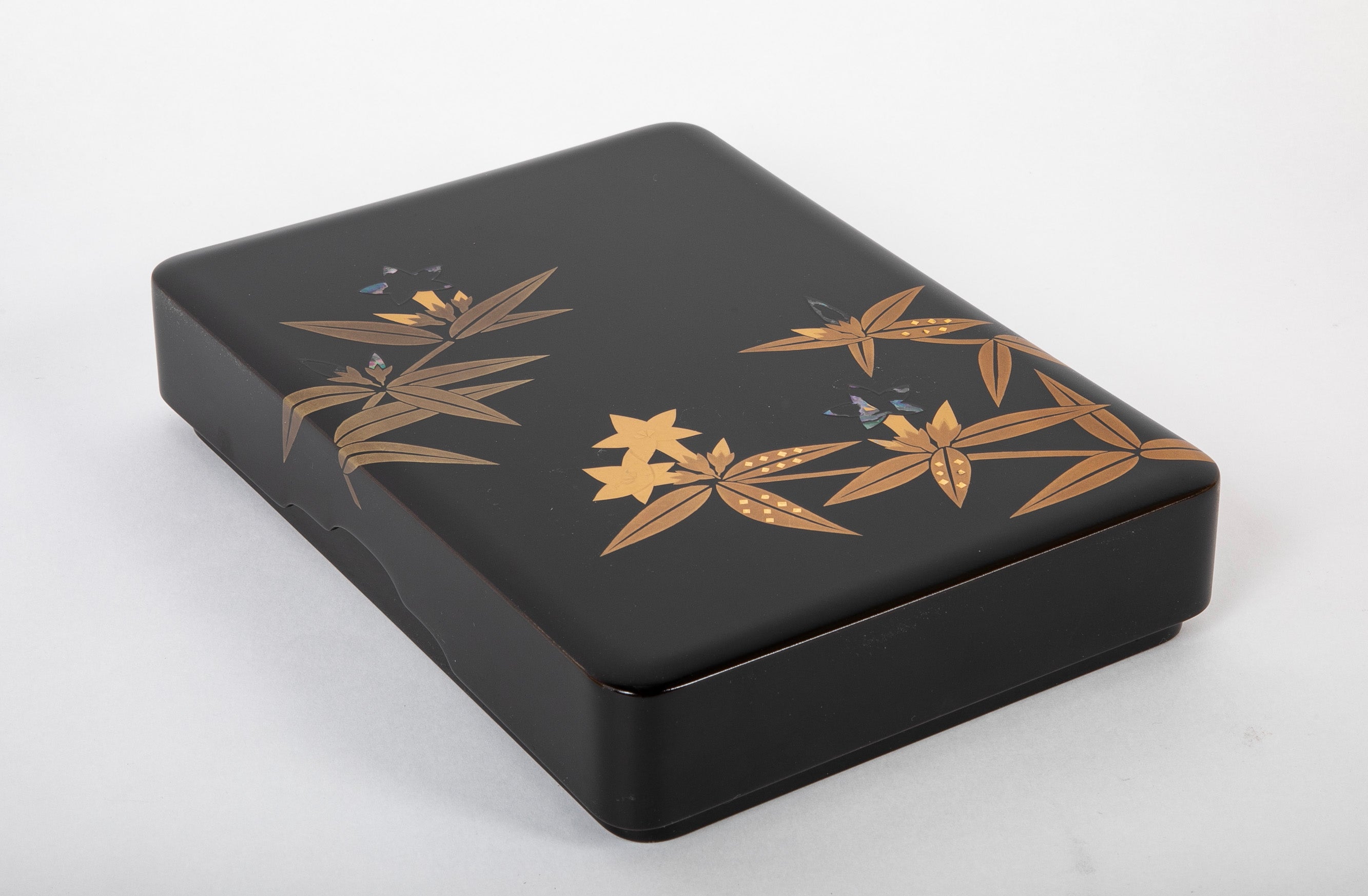 A Wajima Lacquered Covered Box with Gilt Leaf Decoration