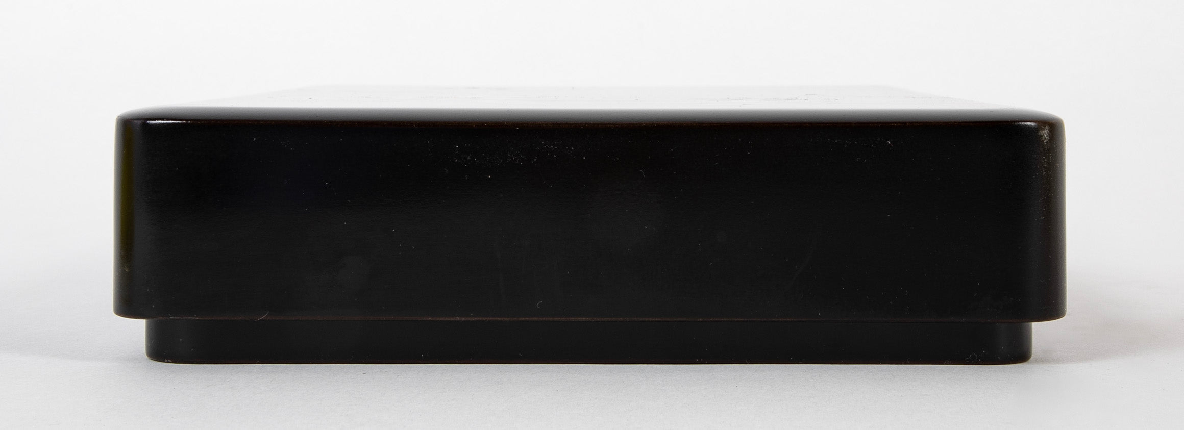 A Wajima Lacquered Covered Box with Gilt Leaf Decoration
