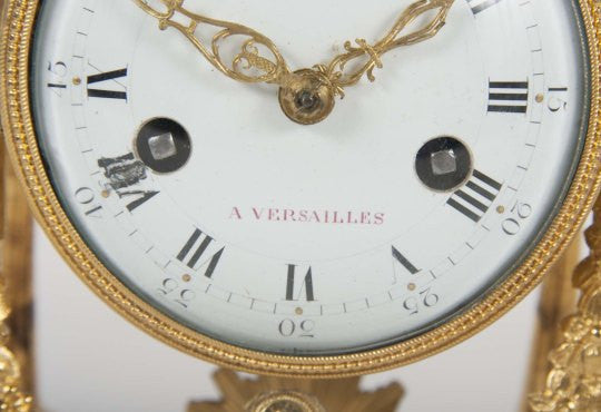 An 18th Century Gilt Bronze French Portico Clock