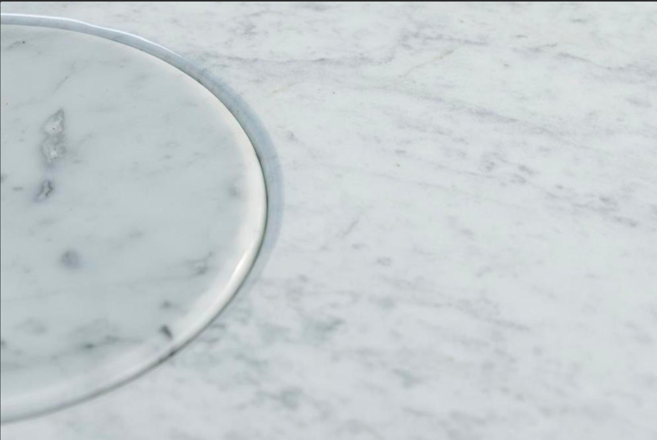 A Carrara Marble Table Designed by Angelo Mangiarotti produced by Skipper