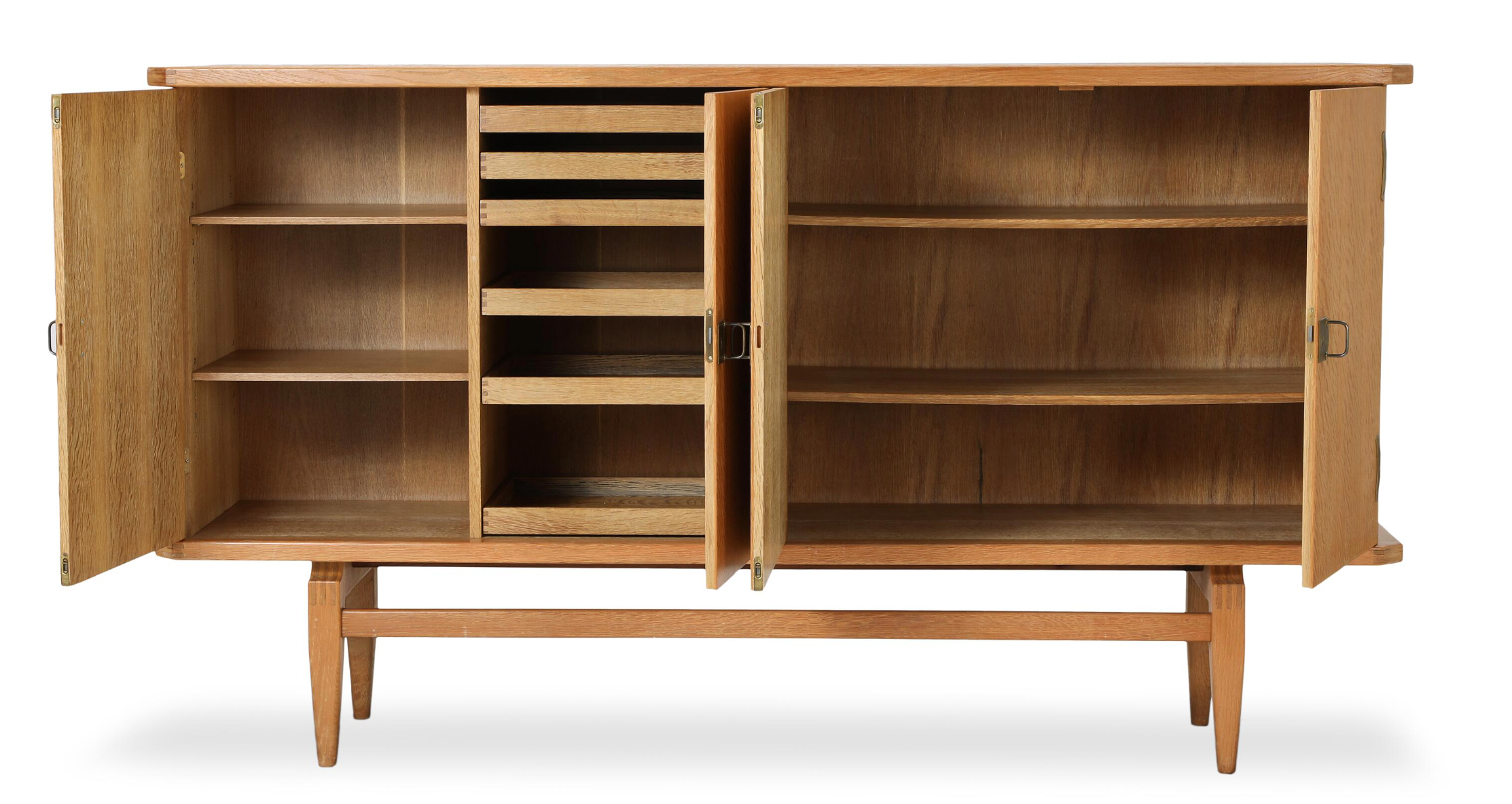 A Four Door Oak Sideboard with Brass Fittings By Henry Kjærnulf