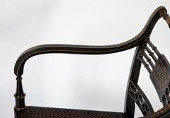 Pair of Regency Ebonized Caned Seat Armchairs