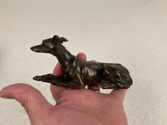 Pair of Regency Bronze Figures of Reclining Whippets on Green Marble Bases