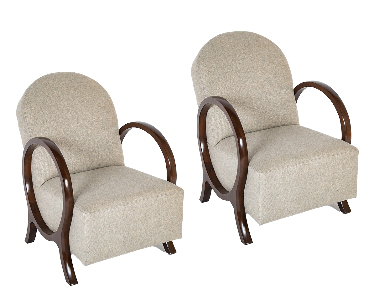 A Pair of Jacques Adnet Beech Armchairs with Circle Arms