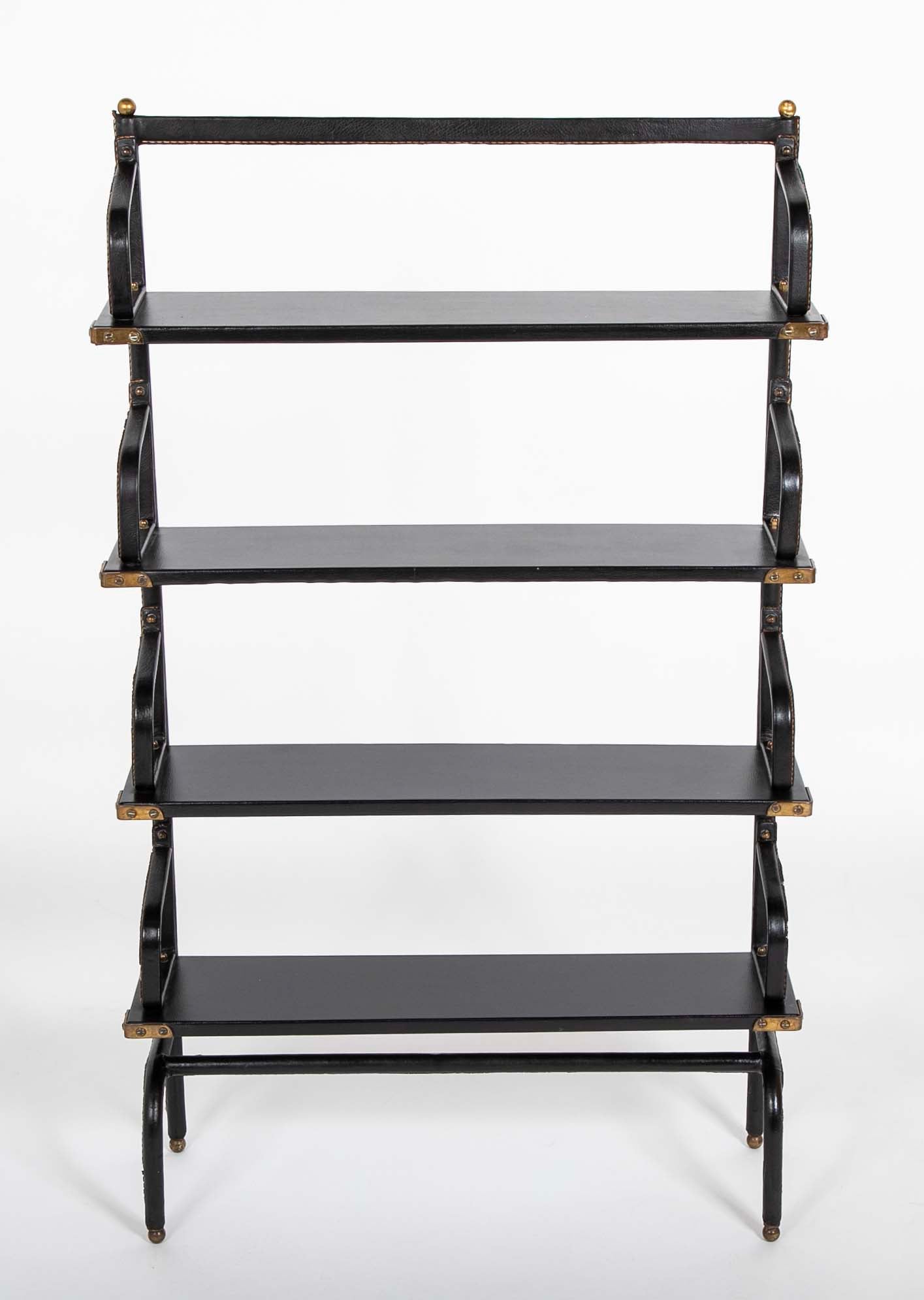 A Jacques Adnet Stitched Black Leather Covered Small Bookcase