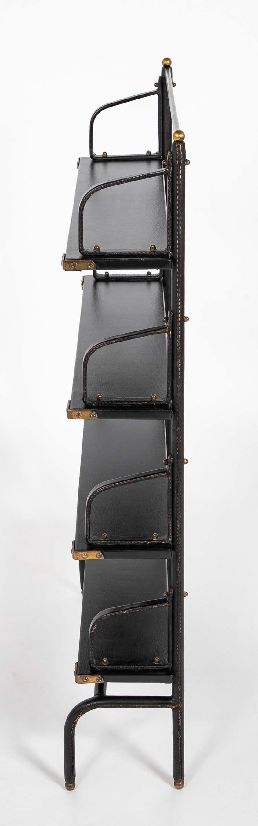A Jacques Adnet Stitched Black Leather Covered Small Bookcase