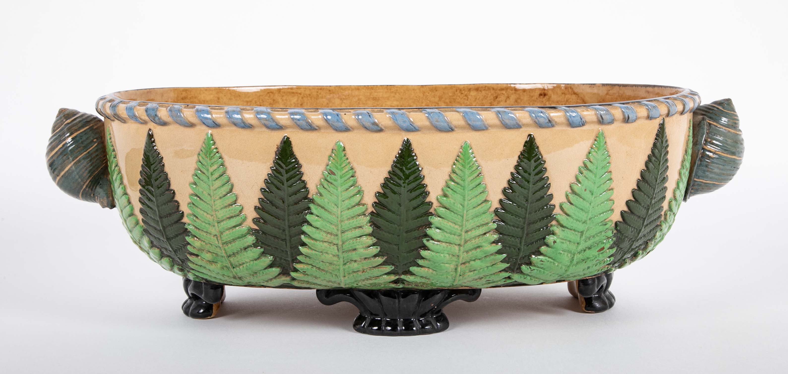 Majolica Slip Glazed Oval Jardiniere With 4 Scrolled Feet And Applied Shell Handles With Green Ferns