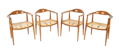 Four Danish Dining Chairs with Arms in the Style of Hans Wegner     Priced Individually at $1,500 EACH