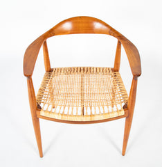 Four Danish Dining Chairs with Arms in the Style of Hans Wegner     Priced Individually at $1,500 EACH