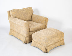 A Current Upholstered Armchair with Matched Ottoman