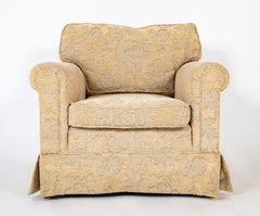 A Current Upholstered Armchair with Matched Ottoman