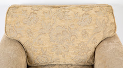 A Current Upholstered Armchair with Matched Ottoman
