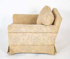 A Current Upholstered Armchair with Matched Ottoman