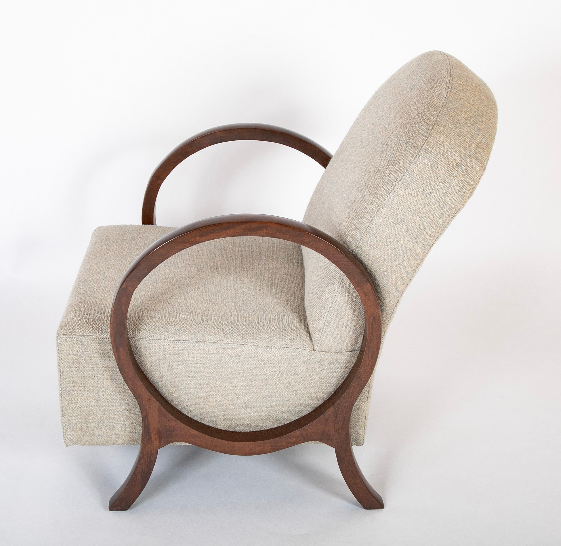 A Pair of Jacques Adnet Beech Armchairs with Circle Arms