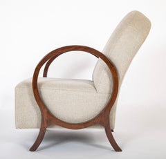 A Pair of Jacques Adnet Beech Armchairs with Circle Arms