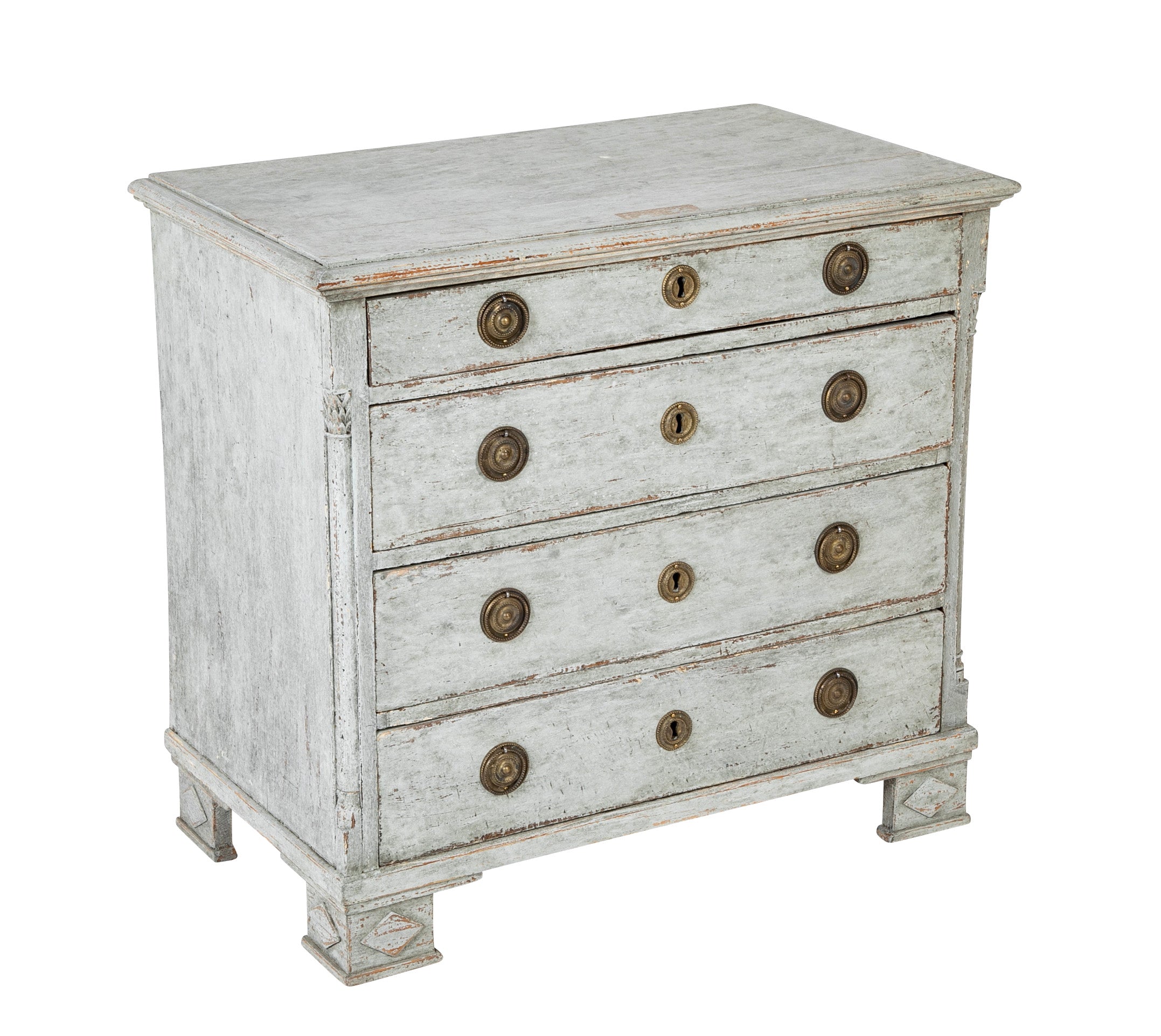 A Louis XVI White Painted Four Drawer Chest