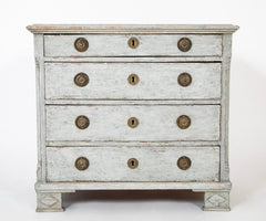 A Louis XVI White Painted Four Drawer Chest