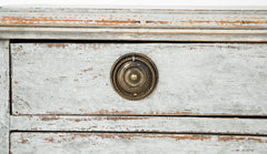 A Louis XVI White Painted Four Drawer Chest