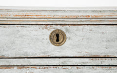A Louis XVI White Painted Four Drawer Chest