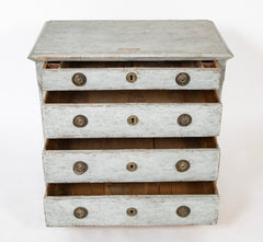 A Louis XVI White Painted Four Drawer Chest