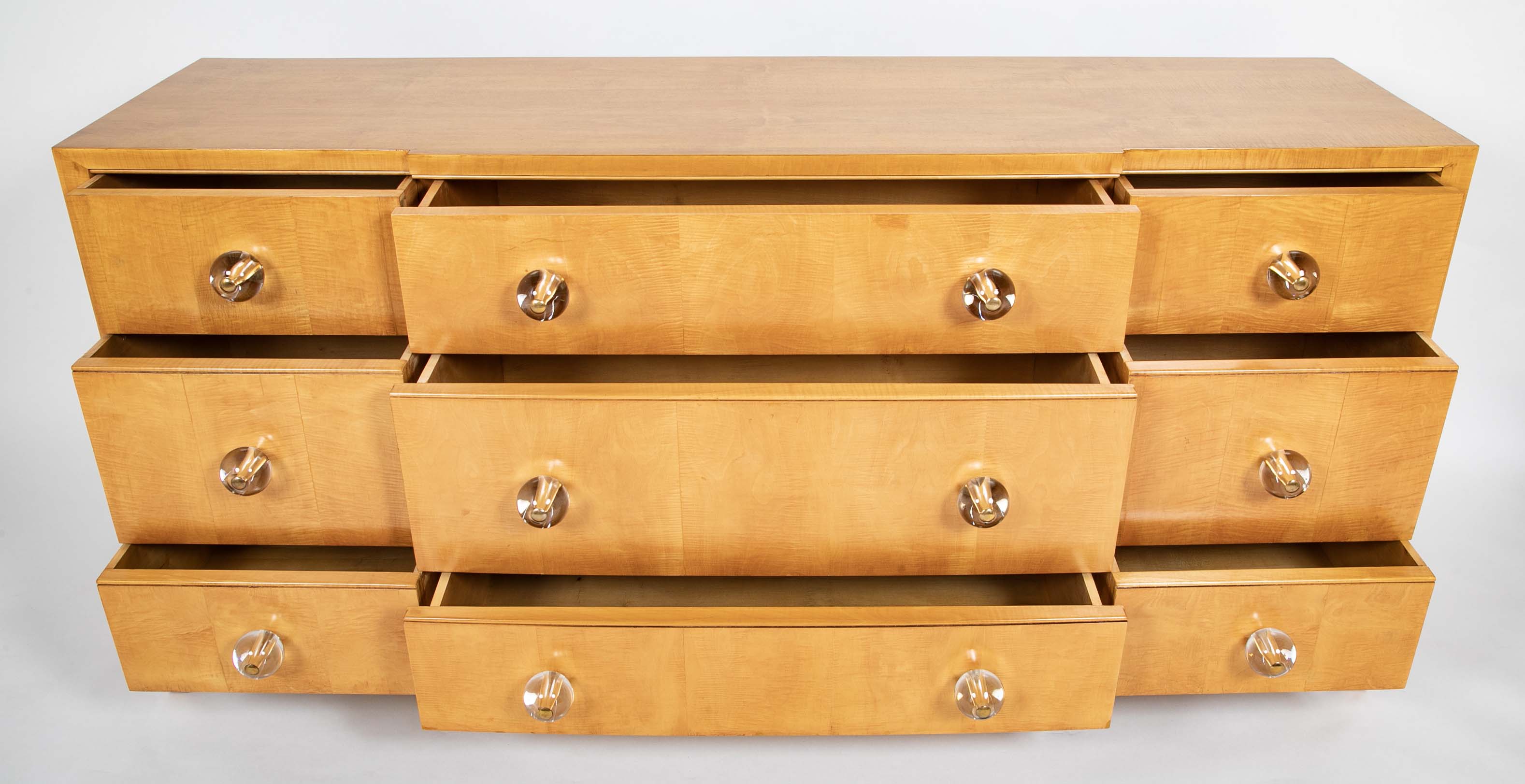 A French Sycamore Veneered Chest of Drawers Attributed to Andre Arbus