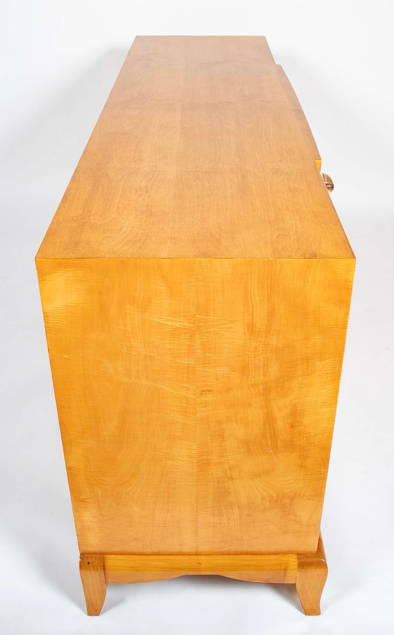 A French Sycamore Veneered Chest of Drawers Attributed to Andre Arbus