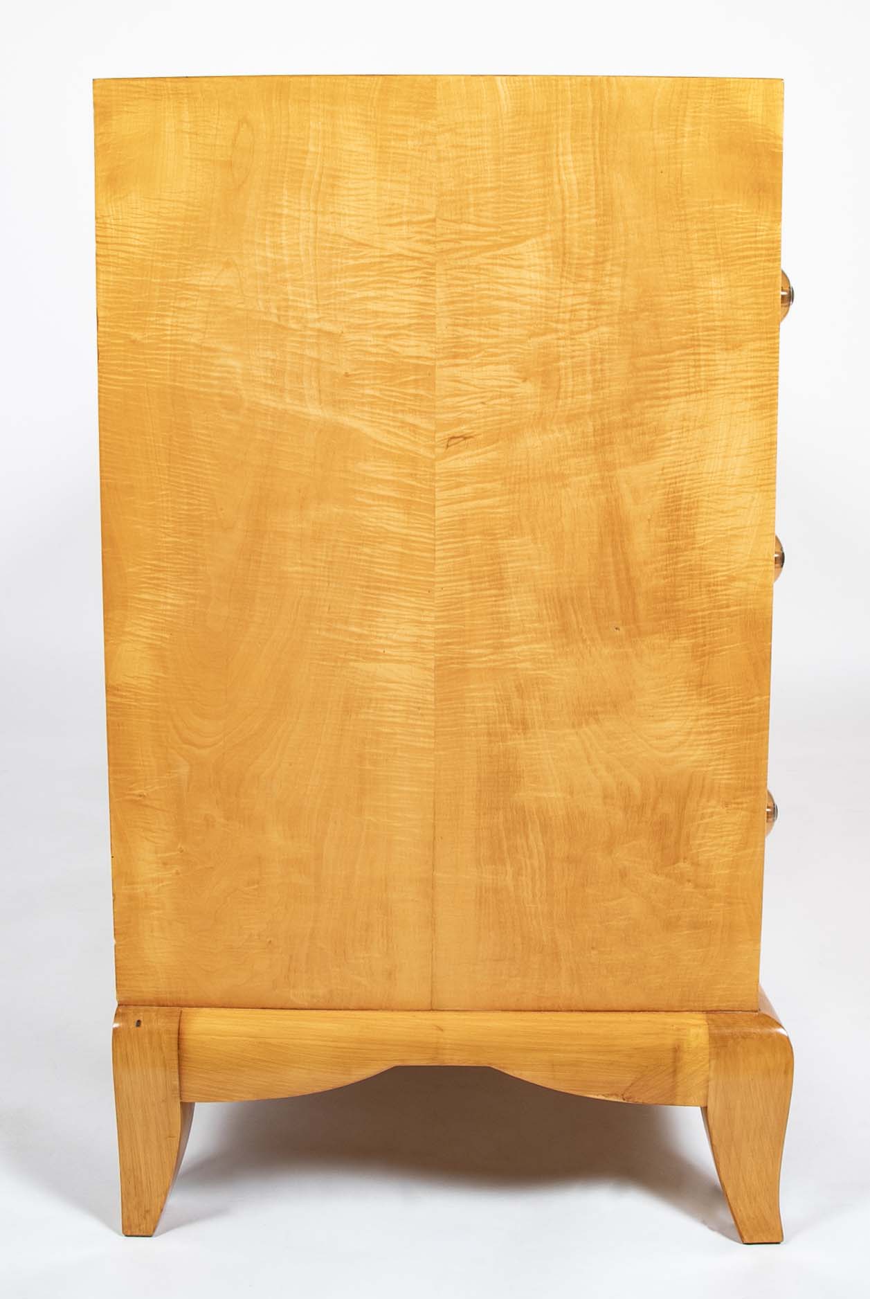 A French Sycamore Veneered Chest of Drawers Attributed to Andre Arbus